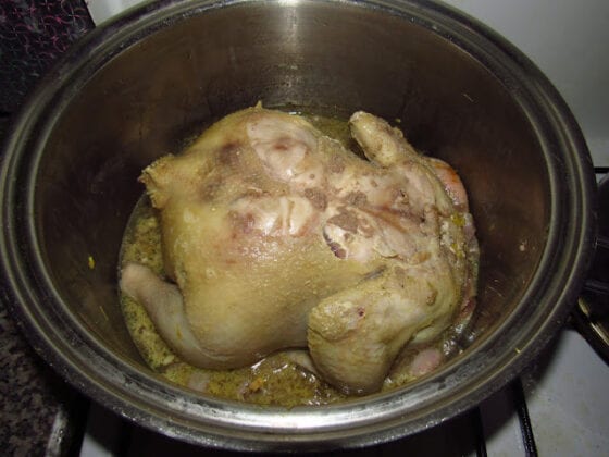 Whole chicken in a pot for making stock